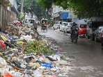 Residents flagged overflowing waste in Sectors 21, 23A and 31 as the sanitation workers’ strike entered its 28th day. (Parveen Kumar/HT)