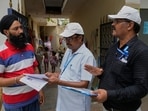Booth Level Officers (BLO) from the Election Commission verifying and explaining the process of Special Intensive Revision (SIR).