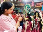 Gram it: As temples, markets and homes across Delhi-NCR dress up for Janmashtami, a devotee pauses to admire a beautifully adorned idol of Lord Krishna in Gurugram. The region is drenched in festive colour, devotional music and prayers, with jhankis, flower showers and aartis setting the stage for Laddu Gopal’s midnight welcome.(Photo: PTI)