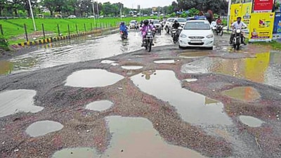 Potholes on the road near Sadar Tehsil in Gomti Nagar Extension-6 after heavy rainfall in Lucknow on Wednesday. Potholes on the road near Sadar Tehsil in Gomti Nagar Extension-6 after heavy rainfall in Lucknow on Wednesday.