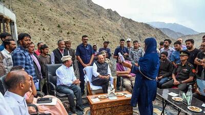 Ladakh lieutenant governor Vinai Kumar Saxena interacts with officials to review ongoing tourism development initiatives during his visit to the historic heritage village of Hunderman near the Line of Control (LoC), in Kargil on Thursday. (ANI Photo)