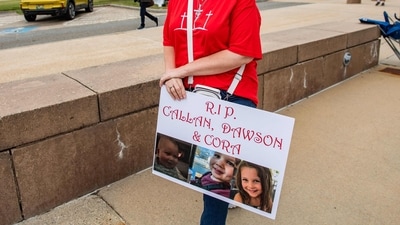 A woman carries a sign to show support for the three murdered children of Lindsay Clancy during the Clancy's murder trial at Plymouth Superior Court in Plymouth, Massachusetts on September 1, 2026. Lindsay Clancy is on trial for the January 2023 strangulation deaths of her three young children. (Photo by JOSEPH PREZIOSO / AFP) (AFP) A woman carries a sign to show support for the three murdered children of Lindsay Clancy during the Clancy's murder trial at Plymouth Superior Court in Plymouth, Massachusetts on September 1, 2026. Lindsay Clancy is on trial for the January 2023 strangulation deaths of her three young children. (Photo by JOSEPH PREZIOSO / AFP) (AFP)