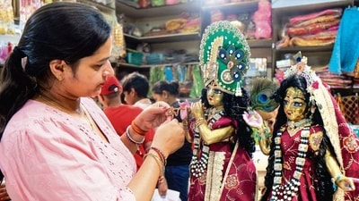 Gram it: As temples, markets and homes across Delhi-NCR dress up for Janmashtami, a devotee pauses to admire a beautifully adorned idol of Lord Krishna in Gurugram. The region is drenched in festive colour, devotional music and prayers, with jhankis, flower showers and aartis setting the stage for Laddu Gopal’s midnight welcome. (Photo: PTI)