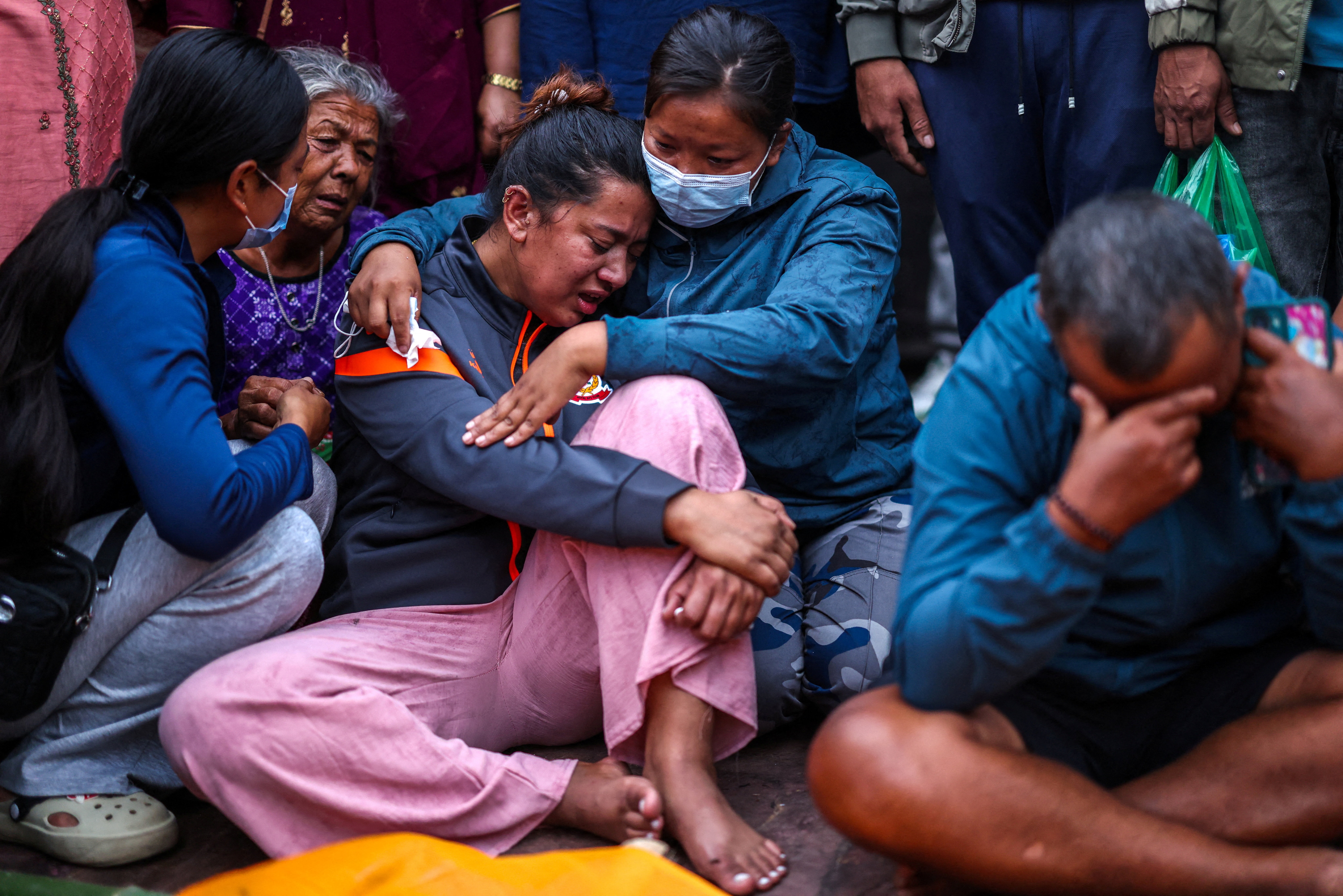 Relatives mourn loved ones in Kathmandu, Nepal. (REUTERS)