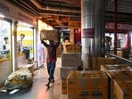 Shopkeepers vacate their shops at the City Centre Mall in Mumbai Central after the BMC takes enforcement action following the Supreme Court's direction regarding the fire-damaged premises.