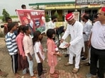 Samajwadi Party workers distribute study kits to children whose local schools no longer function. (Sourced) Samajwadi Party workers distribute study kits to children whose local schools no longer function. (Sourced)