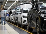 Technicians work at the production line for electric car models of the Volkswagen Group in Zwickau, Germany.