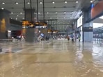 Delhi rains: Visuals from the airport showed people carrying luggage trolleys through ankle-deep water.