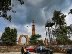 File image: Dark clouds hover over the Qutub Minar during light rain in Delhi 
