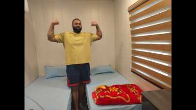 Tajinder Pal Singh Toor in the shipping container in Patiala which is a replica of the unique accommodation awaiting athletes at the Aichi-Nagoya Asian Games. (HT) Tajinder Pal Singh Toor in the shipping container in Patiala which is a replica of the unique accommodation awaiting athletes at the Aichi-Nagoya Asian Games. (HT)