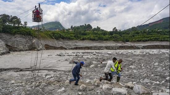 Nuwakot: Workers pull ropes as people use a makeshift zipline to cross the Trishuli river from Koloni in the aftermath of the recent flash floods, in Nuwakot district, Nepal, Friday, Sept. 4, 2026. (PTI Photo/Karma Bhutia) (PTI09_04_2026_000065B) (PTI)