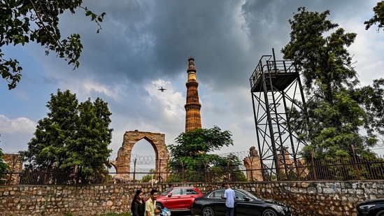 File image: Dark clouds hover over the Qutub Minar during light rain in Delhi (RAJ K RAJ /HT PHOTO)