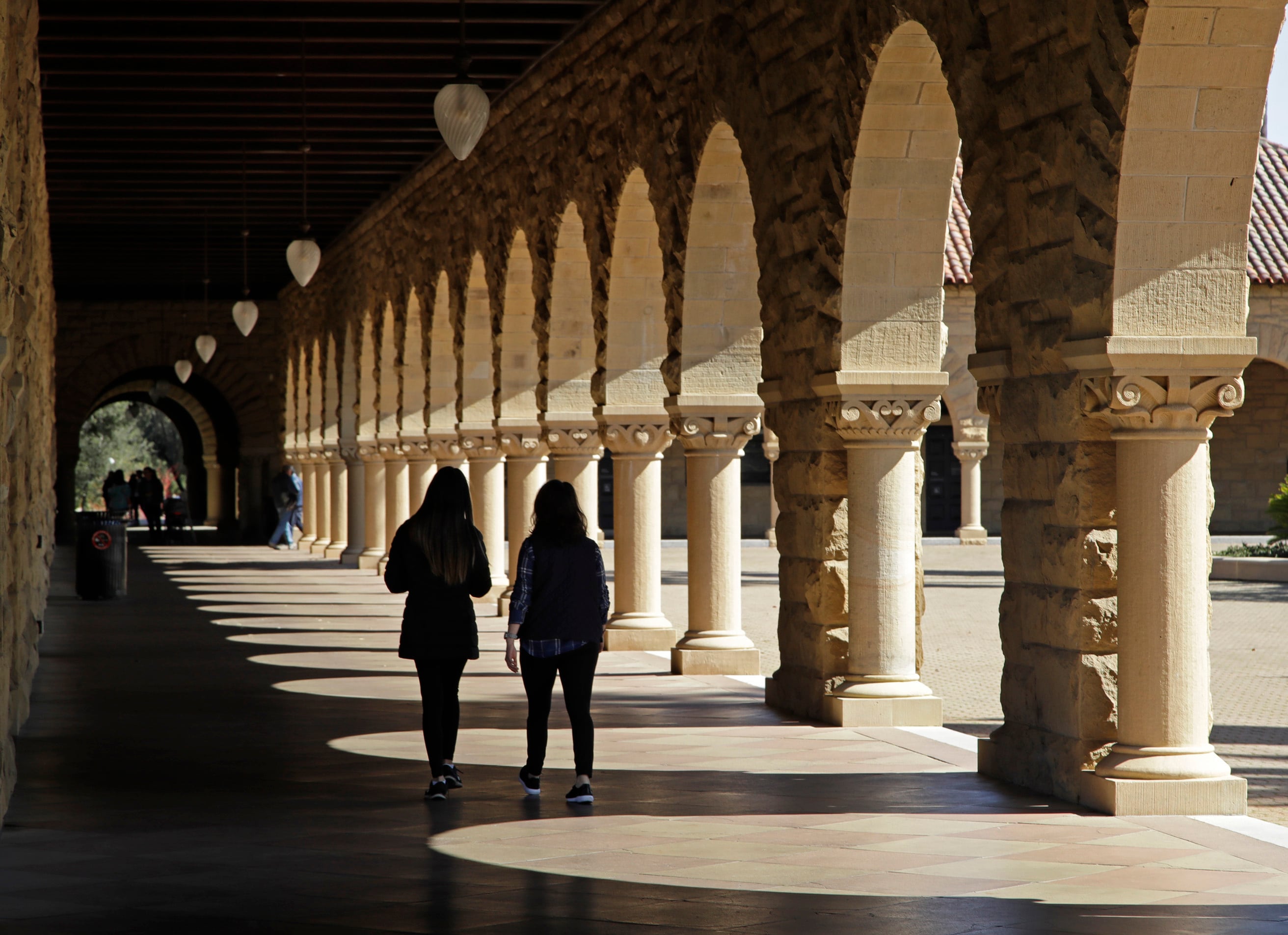 Google says Page and Brin reportedly “disagreed about nearly everything” during their first encounter. [In picture: Students walk through the Stanford University campus, March 14, 2019, AP Photo]