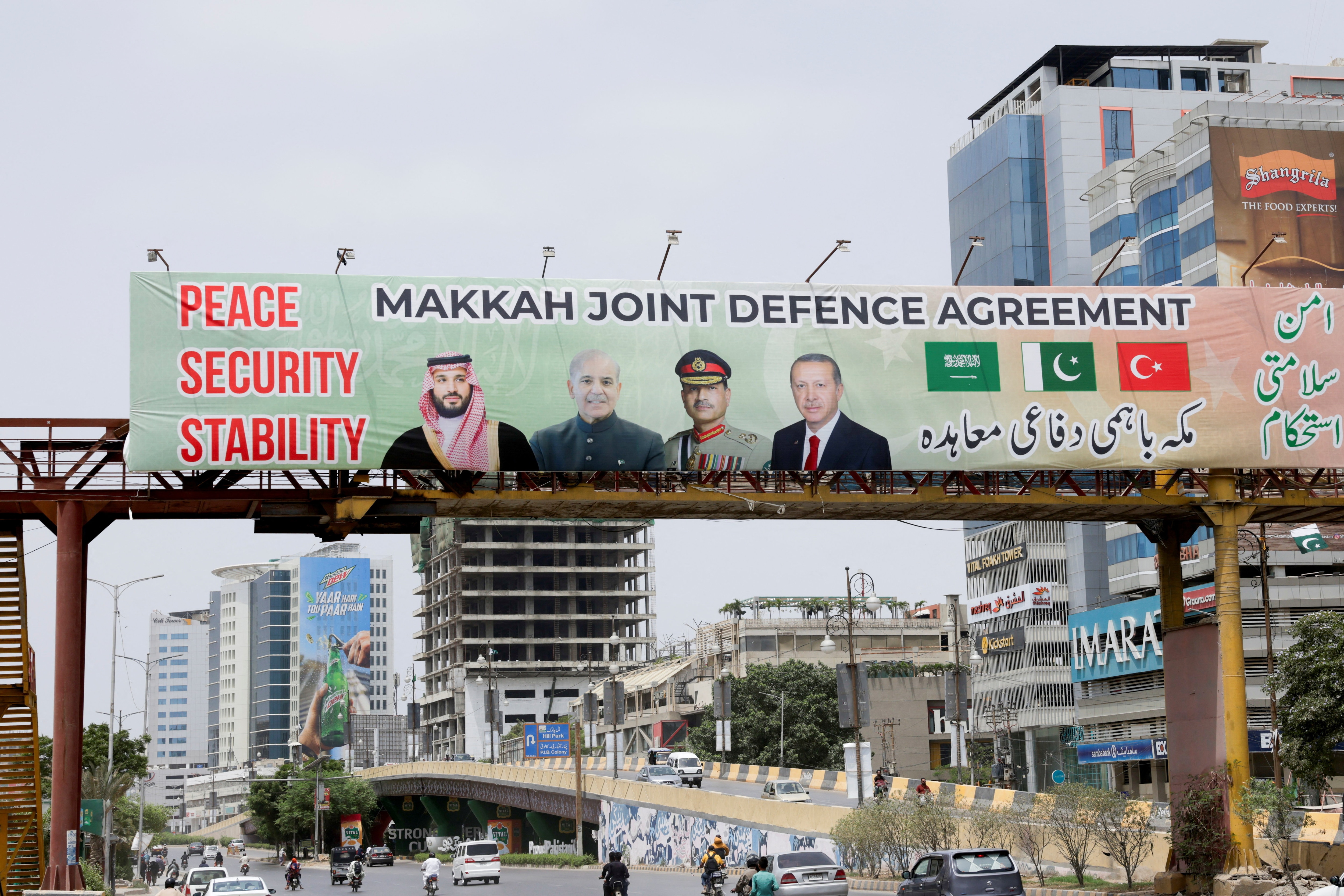 A billboard displays portraits of Saudi Crown Prince and Prime Minister Mohammed bin Salman, Pakistan's Prime Minister Muhammad Shehbaz Sharif, Pakistan's Chief of Defence Forces (CDF) and Chief of Army Staff, Field Marshal Asim Munir, and Turkish President Recep Tayyip Erdogan, following the signing of the Makkah Joint Defence Agreement, in Karachi, Pakistan, August 9, 2026. (REUTERS)