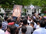 Supporters of Hindutva influencer Swatantra Bhardwaj stage a protest outside Parliament Street police station following his detention. 