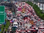The worst of the chaos unfolded on the expressway connecting Gurugram and Delhi, where a traffic snarl stretching nearly 10 kilometres left thousands of commuters trapped for hours. (PTI)