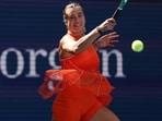 Aryna Sabalenka, of Belarus, returns the ball to Kamilla Rakhimova. 