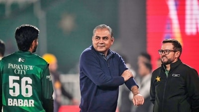 Pakistan's Interior Minister and Chairman of Pakistan Cricket Board Mohsin Naqvi, centre, chats with Pakistan's Babar Azam. (AP) Pakistan's Interior Minister and Chairman of Pakistan Cricket Board Mohsin Naqvi, centre, chats with Pakistan's Babar Azam. (AP)