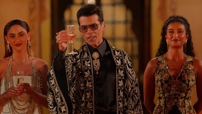 Krystle D'Souza and Rida Tharana with host Karan Johar in The Traitors Season 2.