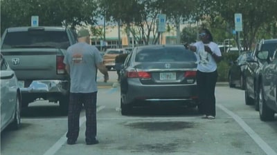 Melissa Payne warned army vet Bart DiGuglielmo not to approach her after a dispute over a parking space, but he didn't listen. (Broward County State Attorney) Melissa Payne warned army vet Bart DiGuglielmo not to approach her after a dispute over a parking space, but he didn't listen. (Broward County State Attorney)