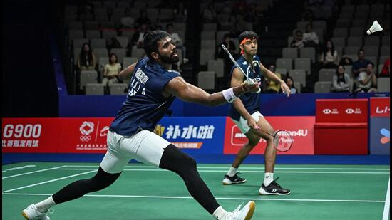 India’s Satwiksairaj Rankireddy (L) and Chirag Shetty play a point during their men’s doubles quarterfinal match against Denmark’s Kim Astrup and Anders Skaarup Rasmussen at the China Masters badminton tournament in Shenzhen. (AFP)