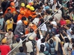 Delhi building collapse LIVE: A person being carried during a rescue operation conducted by NDRF, Delhi Fire Service and Delhi Police after a building collapsed near Satya Niketan at South-West Delh