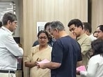 Delhi Chief Minister Rekha Gupta speaks with doctors and health officials at the AIIMS Trauma Centre and takes stock of the health condition of individuals who have been brought here after being rescued from the Satya Niketan building collapse site, in New Delhi on Sunday.