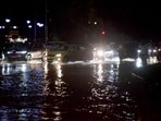Commuters navigate through a waterlogged road in Chandigarh on Saturday. (Ravi Kumar/HT)