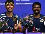 Indian pair Satwiksairaj Rankireddy (R) and Chirag Shetty celebrate after winning the men’s doubles final against China’s Ren Xiangyu and He Jiting at the China Masters badminton tournament in Shenzhen on Sunday. (AFP)