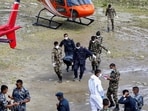 Nepal Army and police personnel carry a dead body to be transferred by helicopter from Dhunche, in Rasuwa district, Nepal, September 1, 2026.