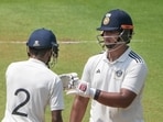East Zone's Vaibhav Sooryavanshi, right, and Abhimanyu Easwaran greet each other between the wickets on day one of the Duleep Trophy 2026-27 final