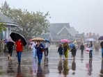 People walk amid rain in Shimla. (PTI File)