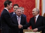 Russian President Vladimir Putin shakes hands with Jared Kushner, U.S. President Donald Trump's son-in-law, as U.S. Special Envoy Steve Witkoff stands nearby during a meeting at the Kremlin in Moscow, Russia, 