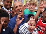 Former US President Barack Obama poses for photographs after reading to school children at the Barack Obama Presidential Center in John Lewis Plaza on June 19, 2026 in Chicago, Illinois. This is the first day the Barack Obama Presidential Center is open to the public. (Photo by Win McNamee / POOL / AFP)(AFP)