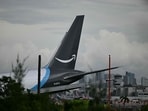 The tail section of a cargo plane is seen at Miami International Airport after it overran the runway at Miami International Airport in Miami, Florida, on September 6, 2026. (Photo by CHANDAN KHANNA / AFP)