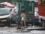Commuters walk through a waterlogged area after Heavy Rain at Anand Parbat in New Delhi, India on Saturday, September 05, 2026.
