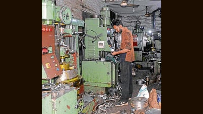 A worker working in an industry in Janta Nagar in Ludhiana. (HT Photo) A worker working in an industry in Janta Nagar in Ludhiana. (HT Photo)