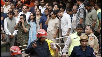 CM Rekha Gupta at the Satya Niketan spot as rescue operations take place. (Sanchit Khanna/HT Photo) CM Rekha Gupta at the Satya Niketan spot as rescue operations take place. (Sanchit Khanna/HT Photo)