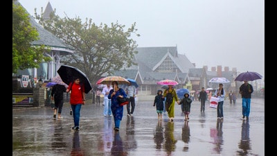 People walk amid rain in Shimla. (PTI File) People walk amid rain in Shimla. (PTI File)