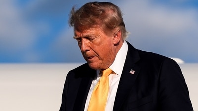 US President Donald Trump disembarks Air Force One at Morristown Airport in Morristown, New Jersey.