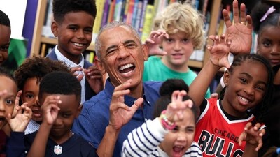 Former US President Barack Obama poses for photographs after reading to school children at the Barack Obama Presidential Center in John Lewis Plaza on June 19, 2026 in Chicago, Illinois. This is the first day the Barack Obama Presidential Center is open to the public. (Photo by Win McNamee / POOL / AFP) (AFP)