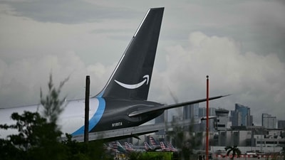 The tail section of a cargo plane is seen at Miami International Airport after it overran the runway at Miami International Airport in Miami, Florida, on September 6, 2026. (Photo by CHANDAN KHANNA / AFP) (AFP)