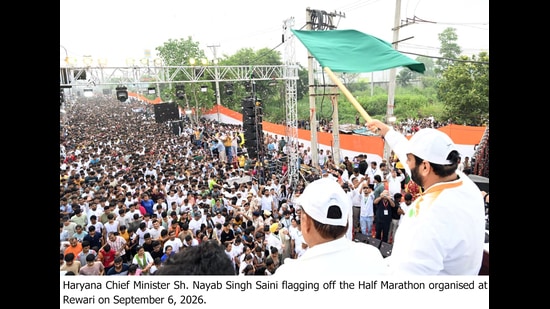 Haryana chief minister Nayab Singh Saini flagging off a marathon in Rewari on Sunday.