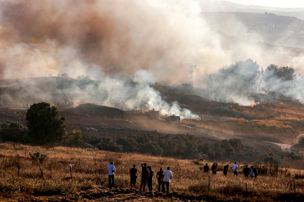 A fire burning between a Palestinian village and the nearby Israeli settlement of Havat Gilad on July 18.