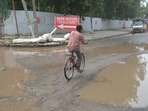 A severely damaged road in Industrial Area, Phase 1, Panchkula on Sunday. (Sant Arora/HT)