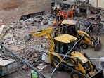 JCB machines remove debris during rescue operations at the site of a building collapse near Satya Niketan in South-West Delhi, in New Delhi on Monday.

