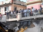 Delhi Chief Minister Rekha Gupta oversees the rescue operations ongoing at the building collapse site in Satya Niketan, in New Delhi on Monday. 

