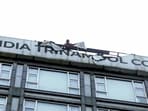 Kolkata Municipal Corporation personnel remove the signboard that reads 'All India Trinamool Congress' from a building on Camac Street that houses TMC MP Abhishek Banerjee's Office, on August 27 (ANI Video Grab)