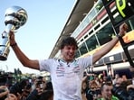 Mercedes' Kimi Antonelli celebrates with fans and the trophy after winning the Italian GP. (REUTERS)