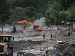 An excavator repairs a damaged road near the Trishuli River, following deadly flash floods and a mudslide, in Jiling, Bagmati Province, Nepal, September 7, 2026.(REUTERS)